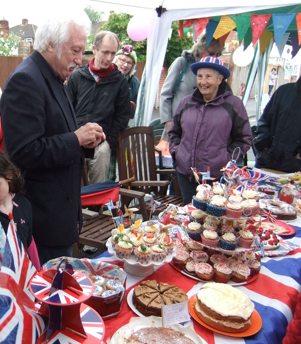 Bill Heine judging the cakes