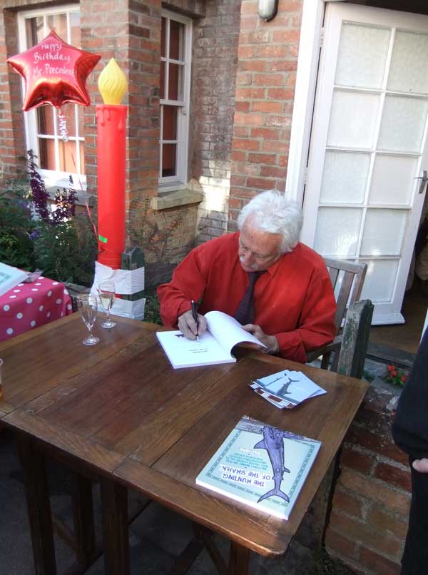 Bill signing his book