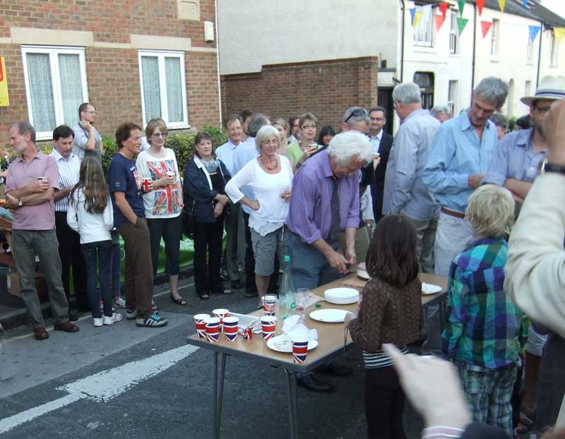 Bill cuts the cake